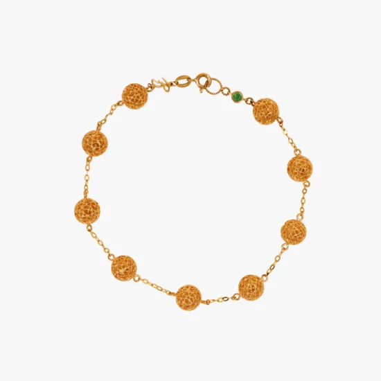 Pulsera línea de esferas filigrana caracol Bauer Herencias oro amarillo 18K y esmeralda